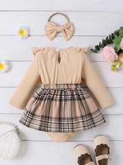 Baby girls' beige ruffled bodysuit with plaid skirt and matching bow headband.
