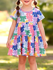 Baby tiered dress with colorful bow print, short sleeves, and round neck.