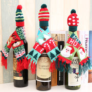 Holiday knit bottle cosies with Santa, reindeer, and candy cane designs.