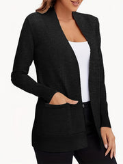 Black textured knit open-front cardigan with pockets and a relaxed fit.
