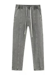 Relaxed fit grey cotton jeans with drawstring and front seams.