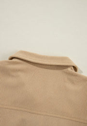 Tan corduroy utility shirt with ruffled pockets, button front, and collar detail.