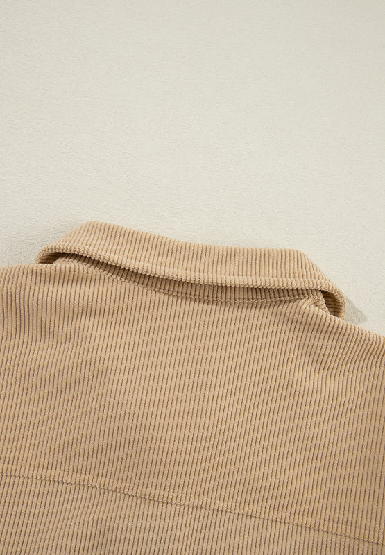 Tan corduroy utility shirt with ruffled pockets, button front, and collar detail.