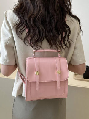 Chic blush pink PU leather mini backpack with gold buckle details.