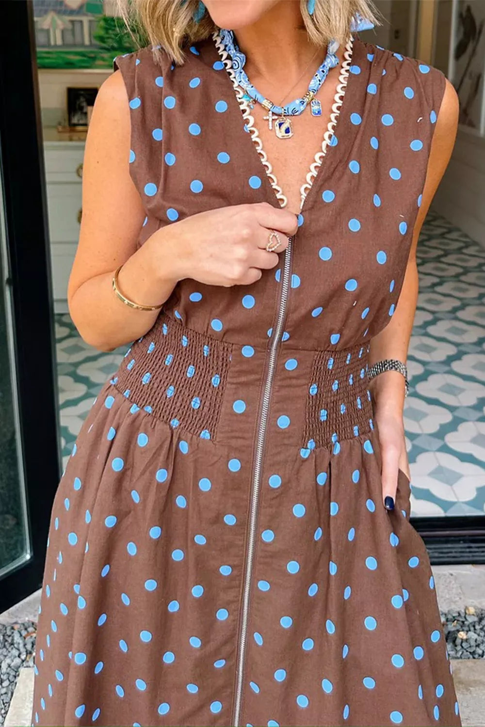 Brown polka dot midi dress with smocked waist and zipper detail