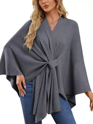 Dark gray knit cape top with V-neck and tie-front detail, draped elegance