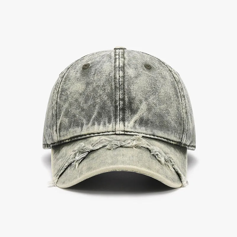 Acid wash distressed baseball cap in a faded grey denim with frayed brim details.