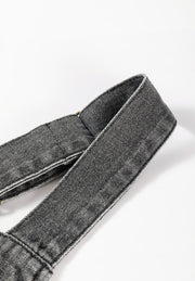 Gray faded denim pinafore dress straps with button detail.