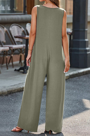 Flowing palazzo jumpsuit in matcha green with V-neck and sleeveless design.