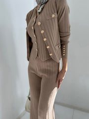 Taupe ribbed knit ensemble with gold buttons, featuring a cardigan and pants.