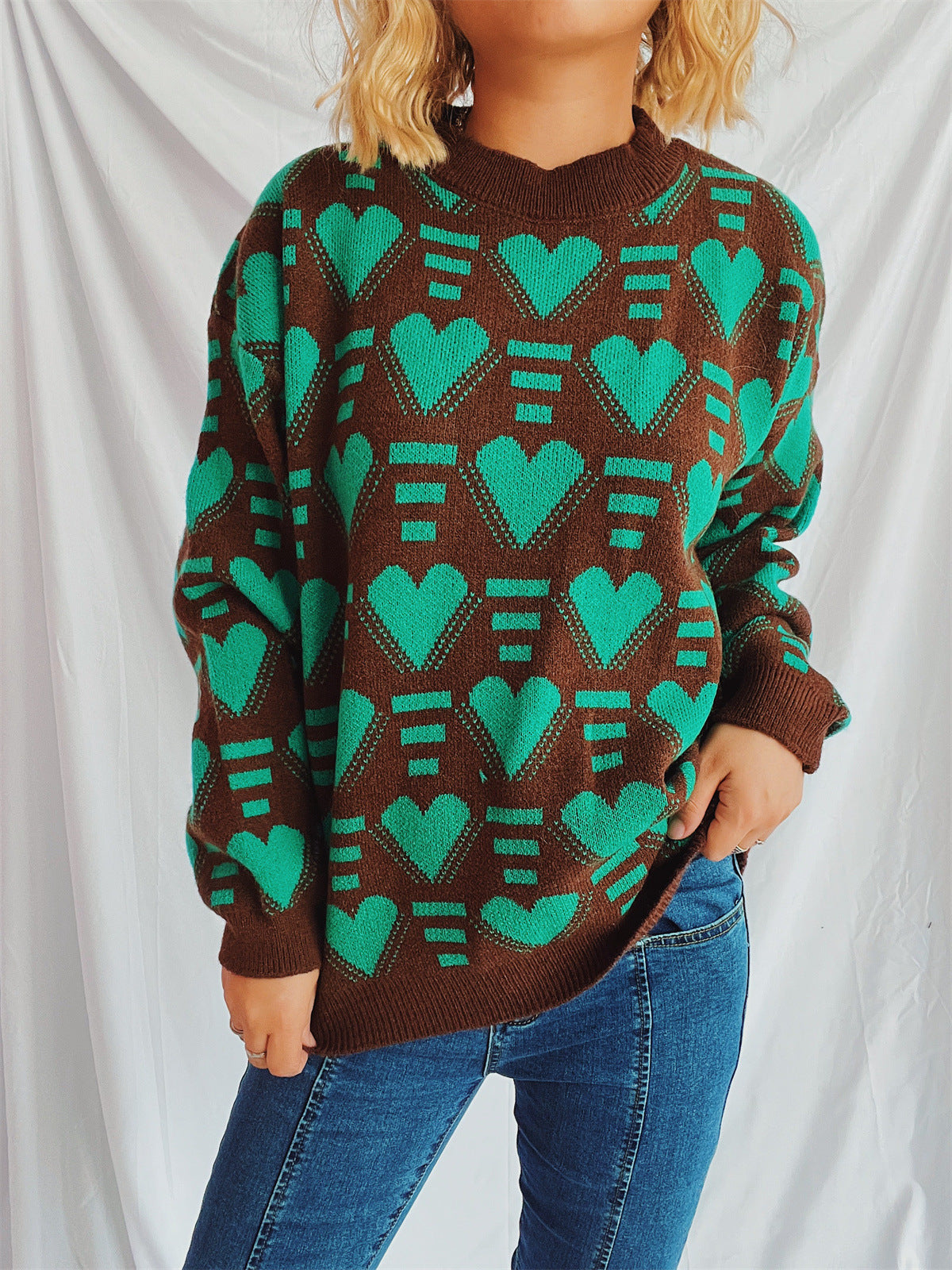 Brown acrylic knit jumper with allover green geometric heart pattern.
