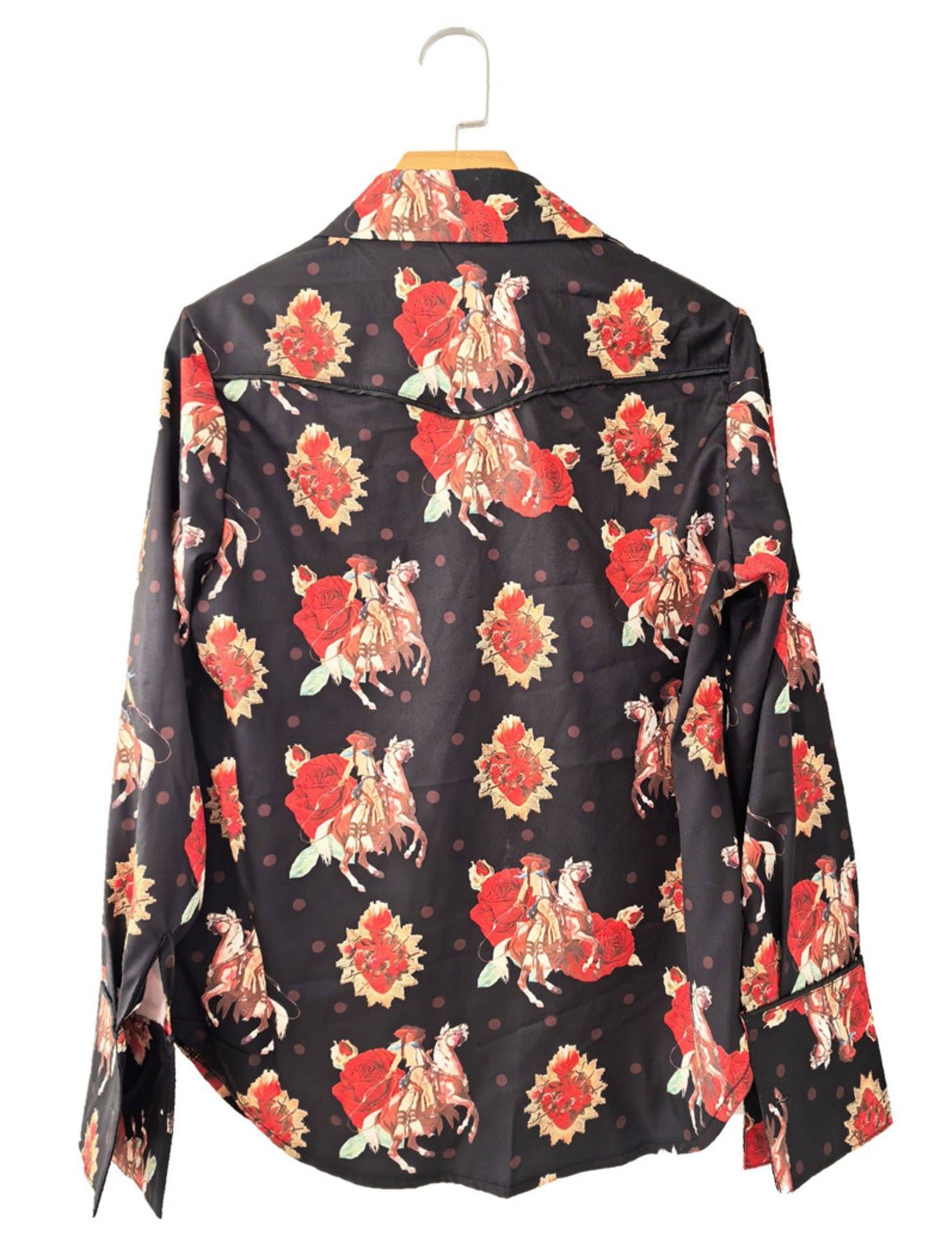 Black long sleeve maternity shirt with rodeo and rose print, polka dot background.