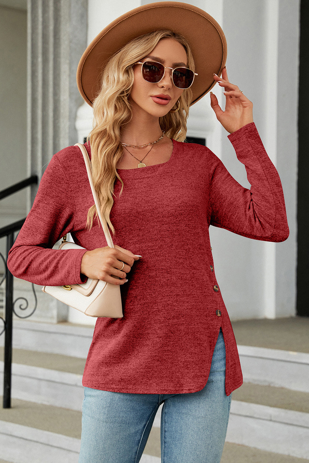 Rust asymmetric long sleeve top with button detail and square neck.
