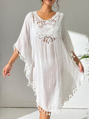 White crochet yoke tassel kaftan dress with short sleeves and a V-neckline.