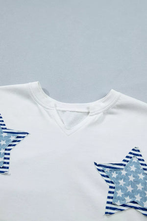 White cotton tee with notched neckline and blue star applique details.