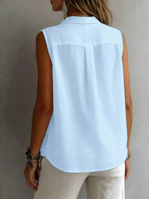 Light blue sleeveless button-up shirt with a classic collar and back pleats.