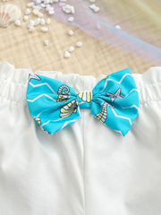 White toddler cami and shorts set with blue seahorse print bow detail
