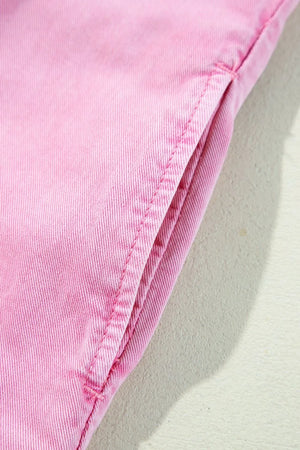 Rolled sleeve denim shirtdress in blush pink with a visible pocket detail.