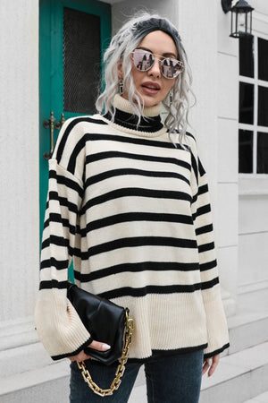 Beige acrylic striped turtleneck sweater with wide bell sleeves and black trim