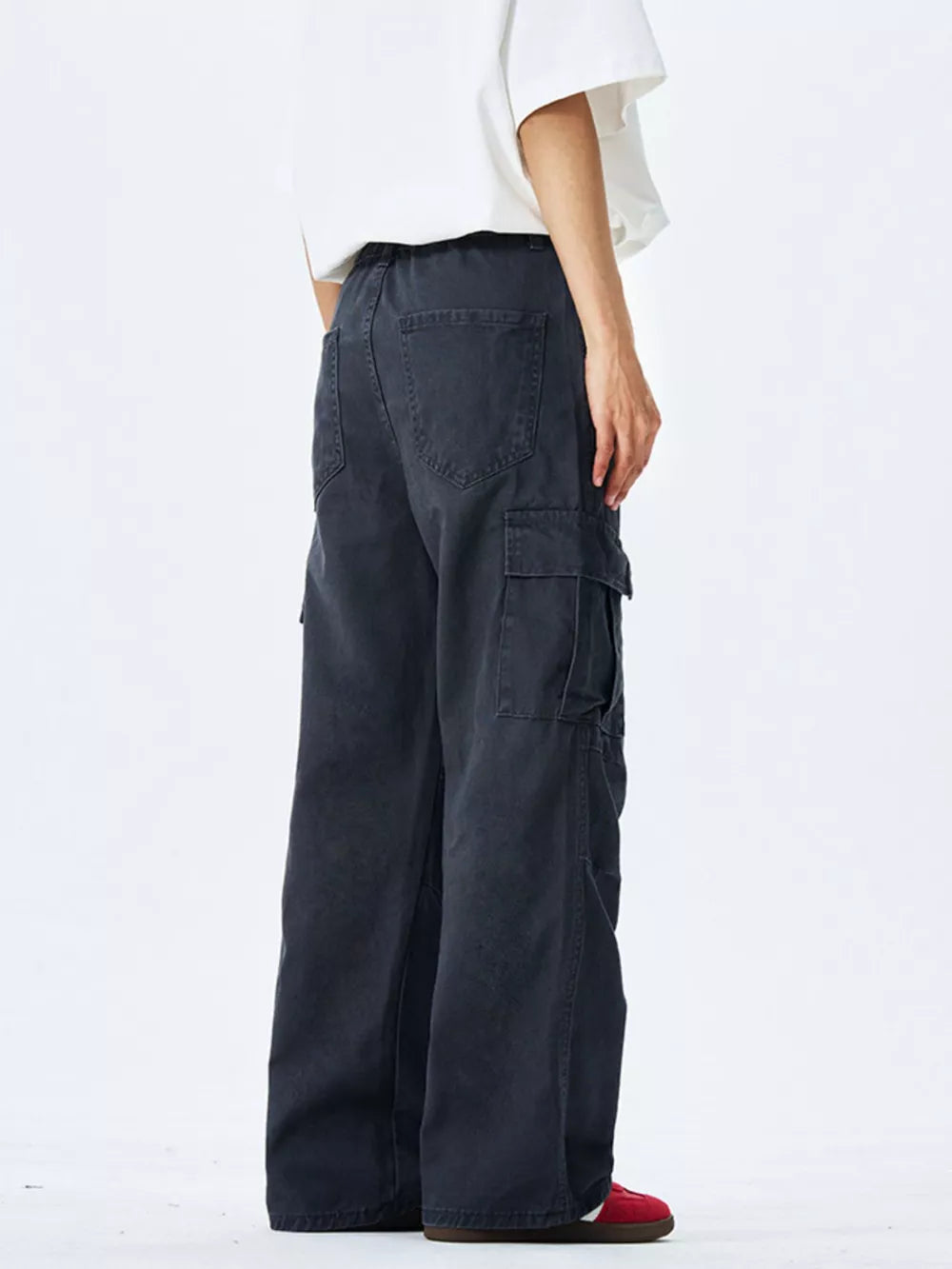 Men's dark gray 100% cotton wide-leg cargo pants with multiple pockets.