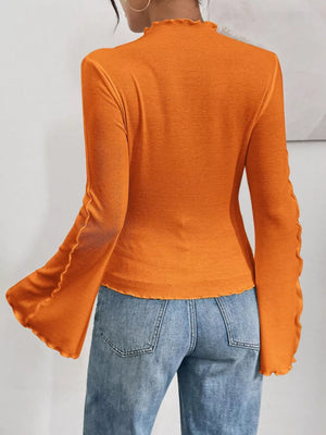 Orange lettuce edge flare sleeve t-shirt with ribbed texture and lettuce trim details.