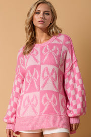Pink acrylic sweater with bow pattern and balloon sleeves, crew neck, casual knit top.