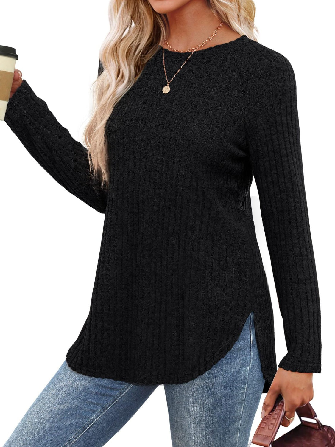 Black ribbed sweater with raglan sleeves and asymmetric hem detail