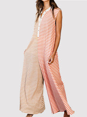 Sleeveless colorblock stripe jumpsuit with button placket and wide legs.