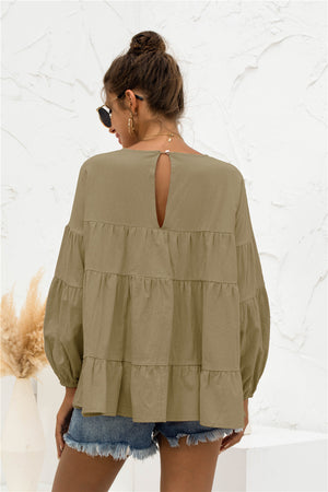 Army green tiered blouse with ruffled bubble sleeves and keyhole back detail.