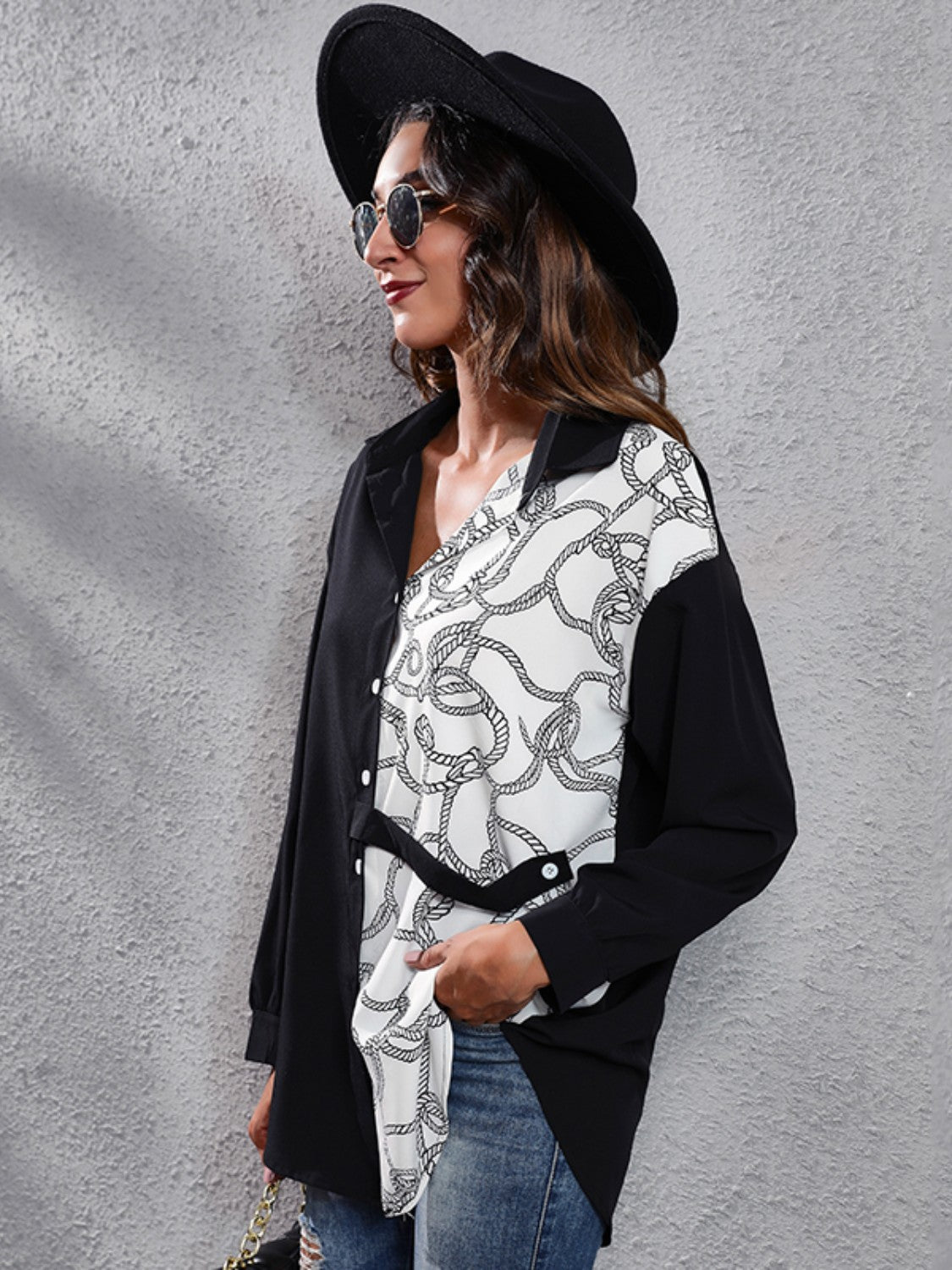 Black and white rope print button-down shirt with black panels and a tie waist.