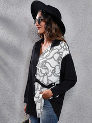 Black and white rope print button-down shirt with black panels and a tie waist.