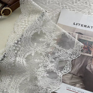 Delicate off-white floral lace scarf with scalloped edge detail.