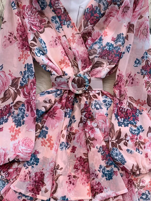 Pink floral ruffle hem wrap mini dress with cinched waist and belt