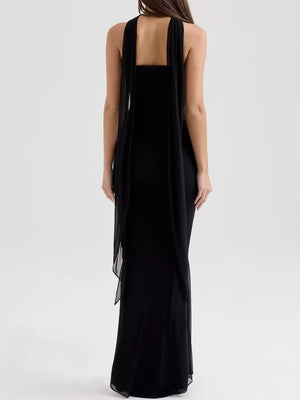 Black sweetheart tube top and flowy maxi skirt set with sheer draped overlay.
