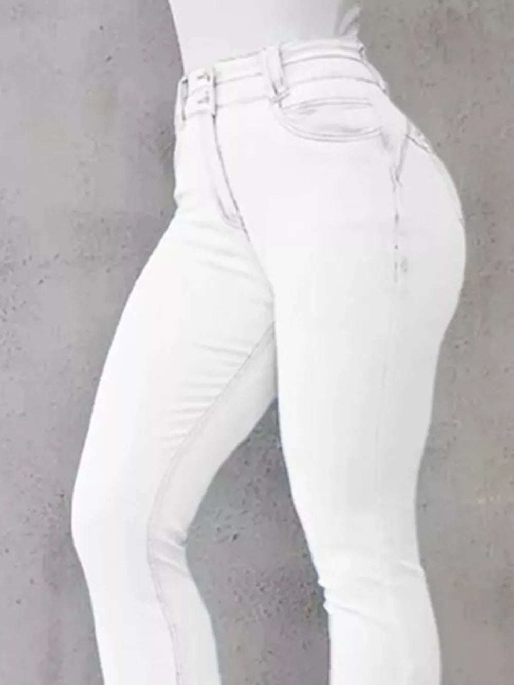 White high-waisted flare jeans with button closure and cotton spandex blend.