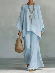 Light blue polyester two-piece set with flowing top and wide-leg pants, boat neck, wide sleeves