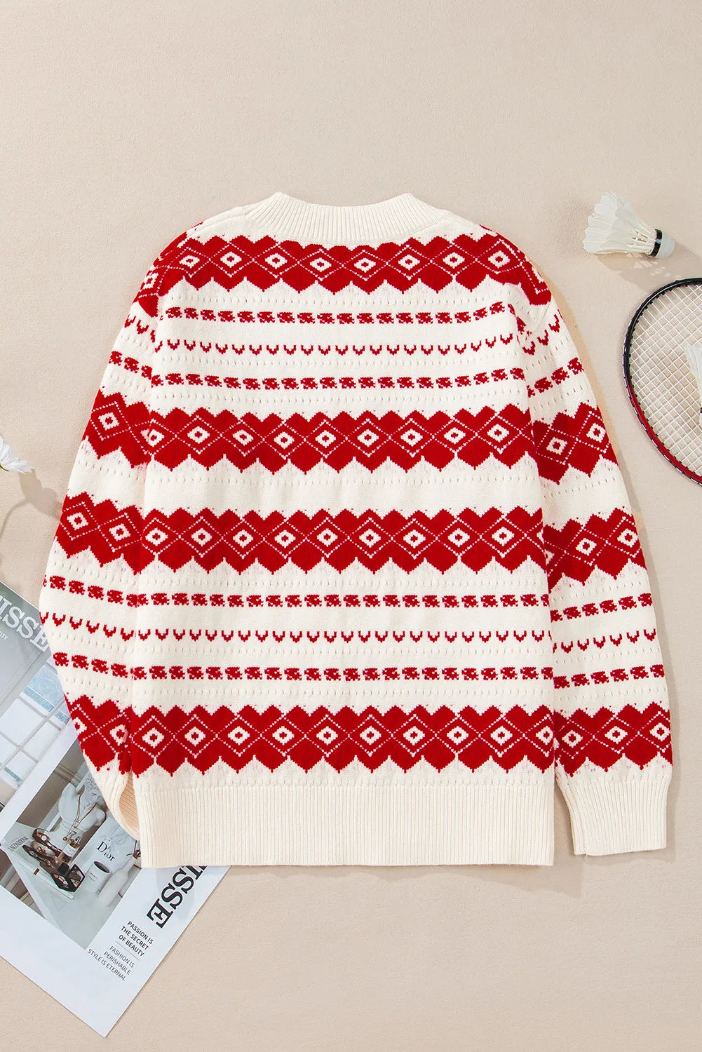 Fair Isle knit crewneck pullover sweater in white with red diamond and stripe pattern.