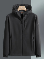 Men's black hooded windbreaker jacket with zippered pockets and subtle chest logo detail.
