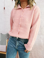 Pink ribbed cardigan with polo collar and button-up front.