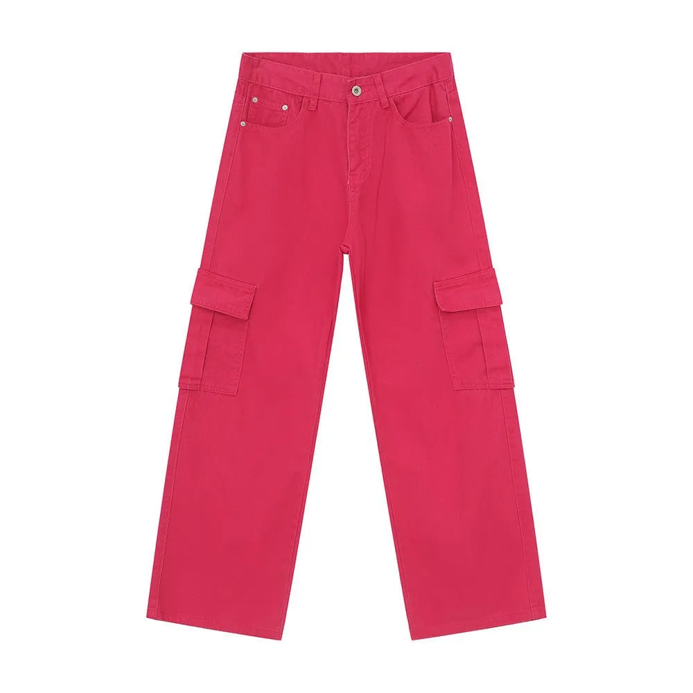 Oversized hot pink denim cargo pants with multiple pockets.