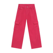 Oversized hot pink denim cargo pants with multiple pockets.