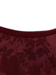 Burgundy floral mesh bodycon mini dress with a crew neck detail.