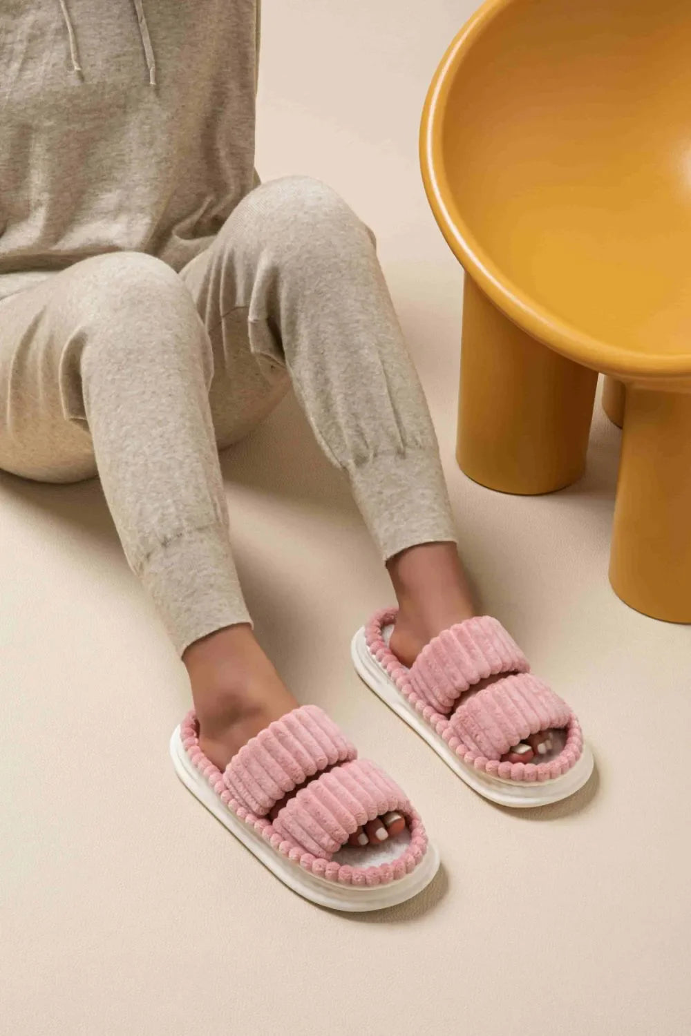 Dusty pink ribbed terrycloth platform slides with double band detail.