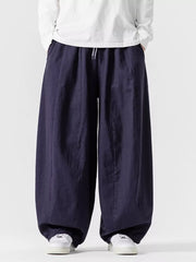 Navy relaxed fit sweatpants with drawstring waist and wide leg