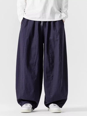 Navy relaxed fit sweatpants with drawstring waist and wide leg