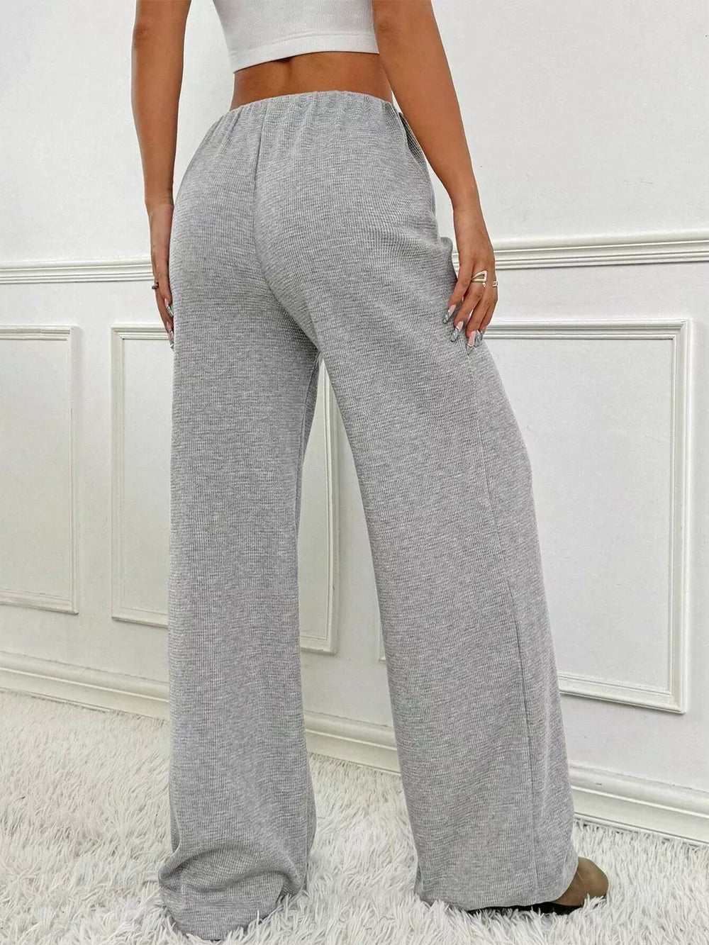 Light Gray ribbed wide-leg pants with drawstring waist and a relaxed fit.