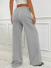 Light Gray ribbed wide-leg pants with drawstring waist and a relaxed fit.