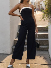 Black bicolor bandeau palazzo jumpsuit with wide legs and a white trim neckline.