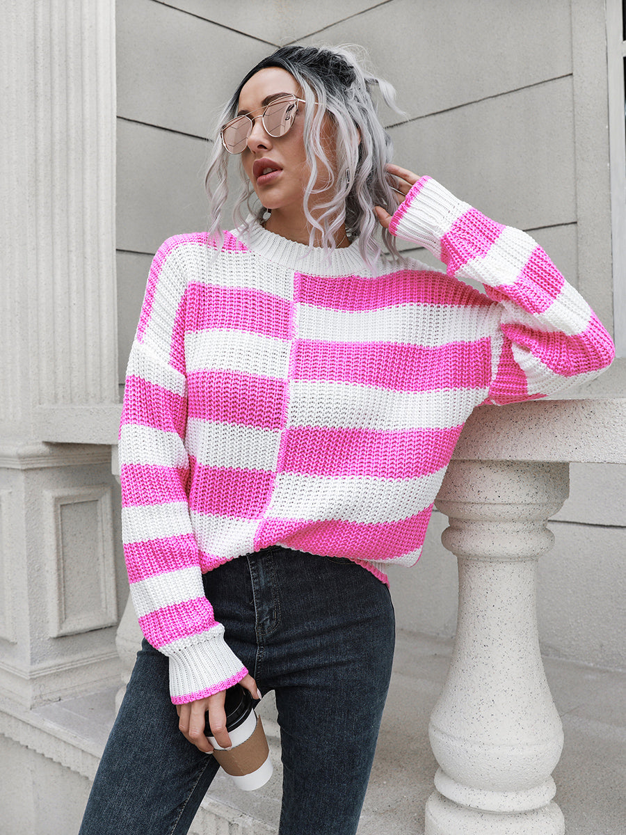 Fuchsia pink and white striped acrylic sweater with crew neck and long sleeves.
