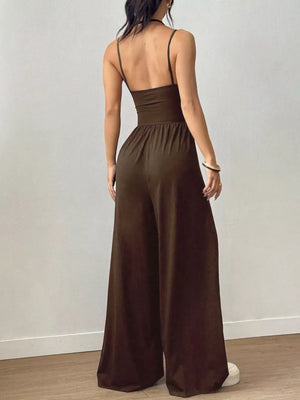 Brown ruched wide-leg jumpsuit with spaghetti straps and a cinched waist.